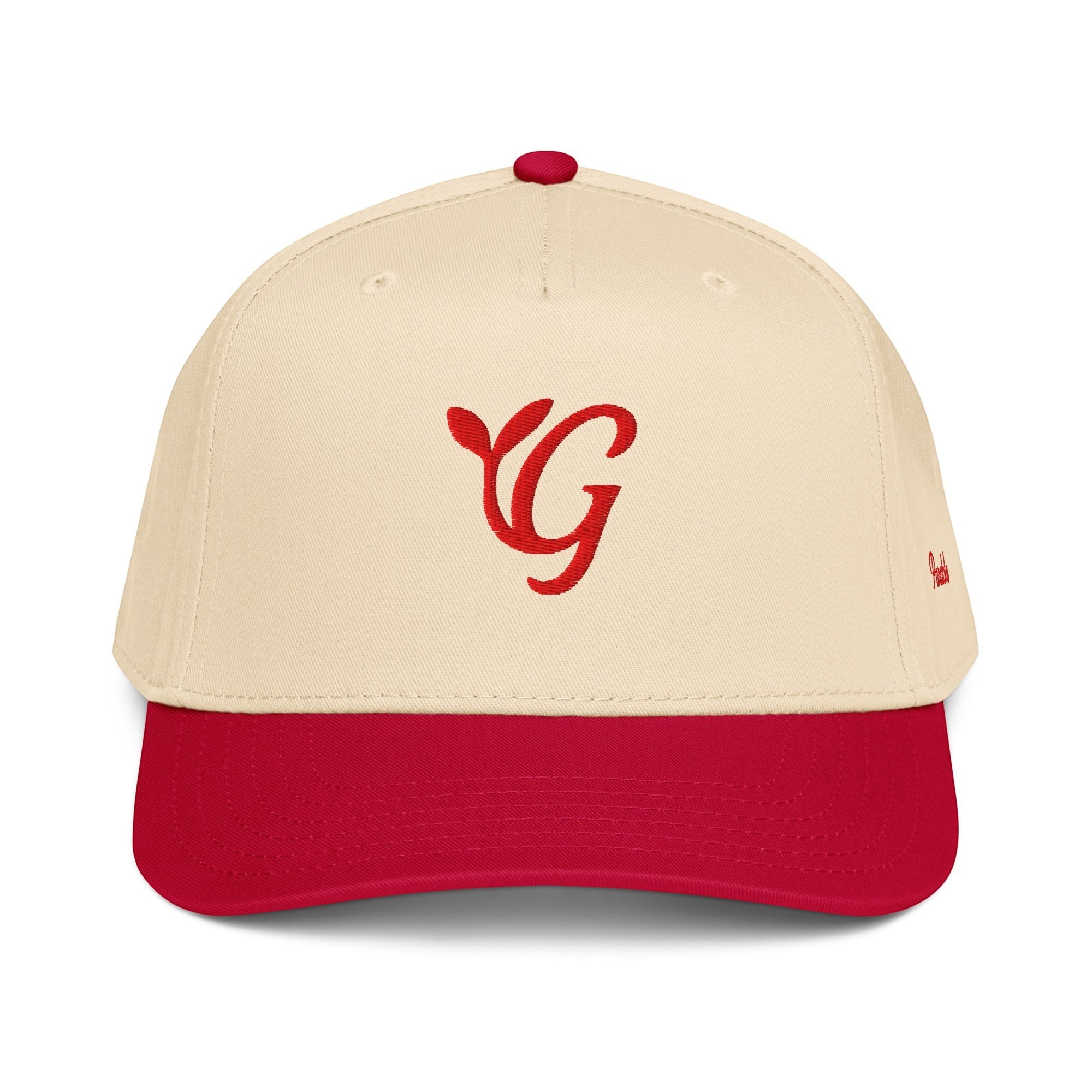 Parable Golf red letter embroidered logo on a cream and red 5-panel hat made of polyester and cotton.
